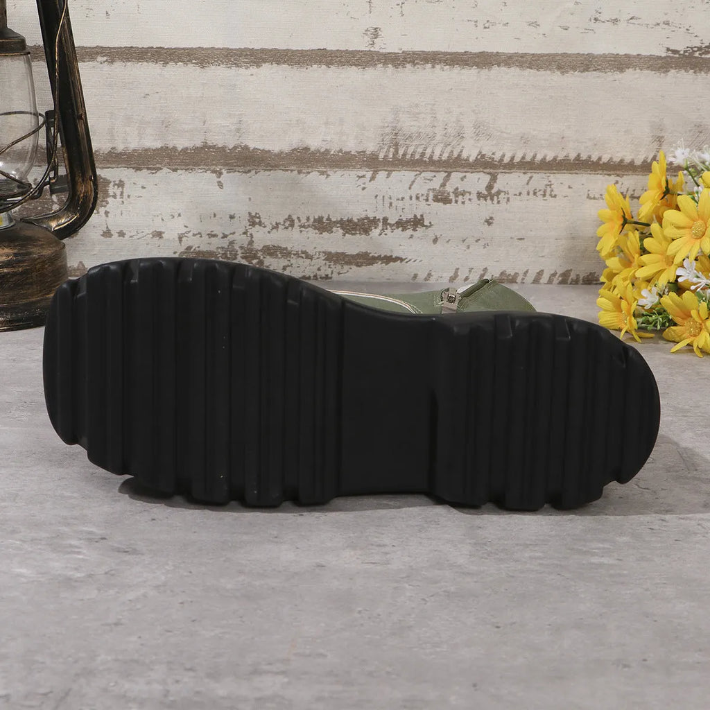 Women's black platform ankle boots with a chunky heel and side zipper on a white background.
