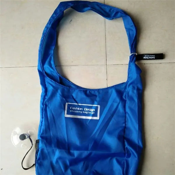 Disc folding portable shopping bag in horizontal medium style with 33x40x10 cm dimensions and 10.5 cm disc diameter in nylon and polyester