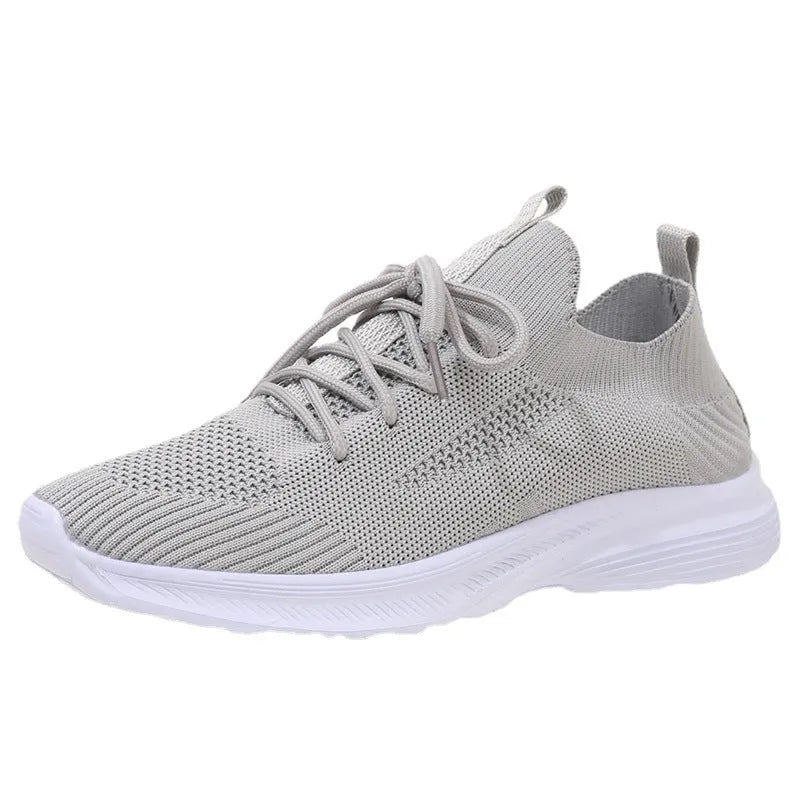 Women's Flyknit mesh running shoes in low-top tennis style with rubber sole