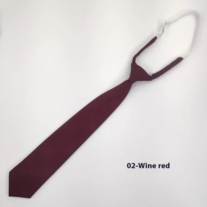 Men's navy blue cotton bow tie with arrow style on a plain background.