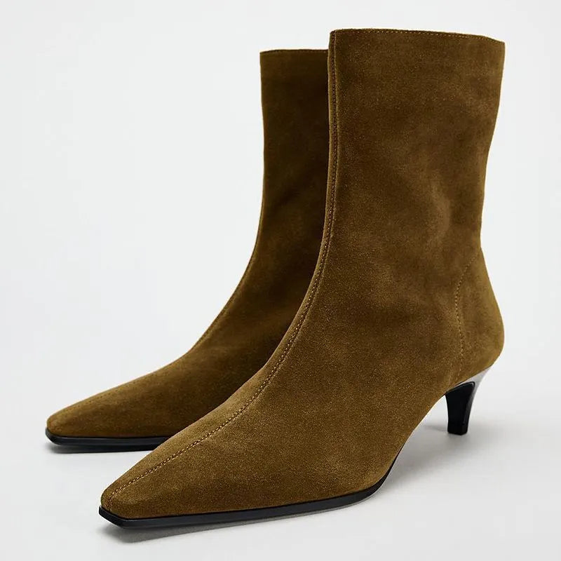 Brown women's square toe ankle boots with a side zipper and a mid stiletto heel on a waterproof platform sole.