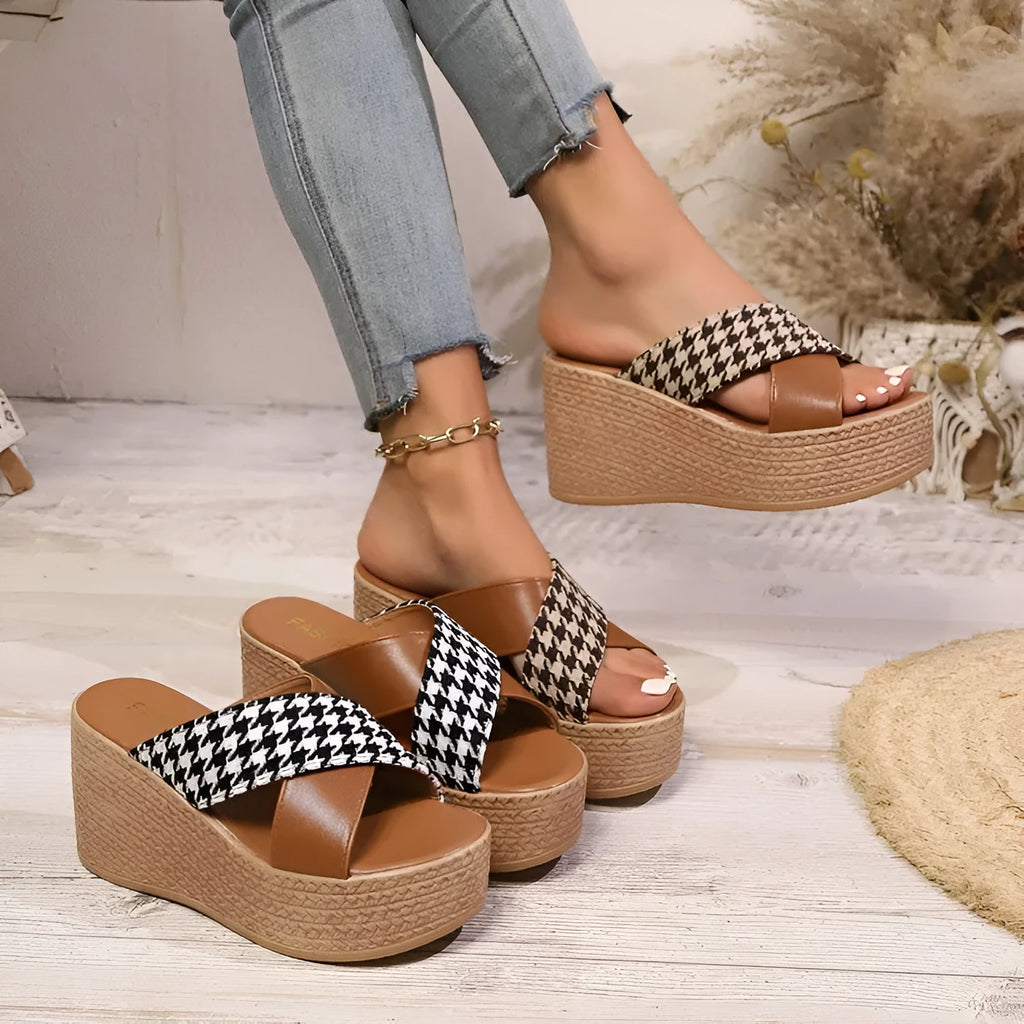 Brown and black cross leopard plaid pattern wedge sandals with a rubber sole.