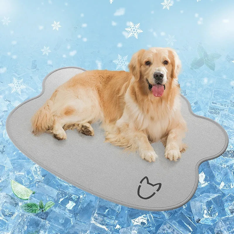 Iced silk pet cooling mat in dark grey with a simple dog head shape, shown on a hardwood floor.