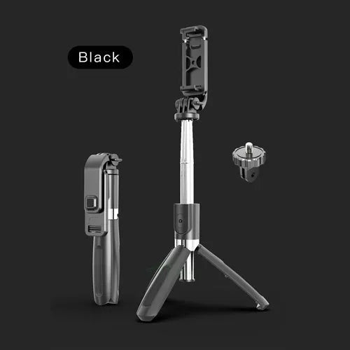 Extended black Bluetooth selfie stick with phone attached, showing remote control and folded tripod legs.
