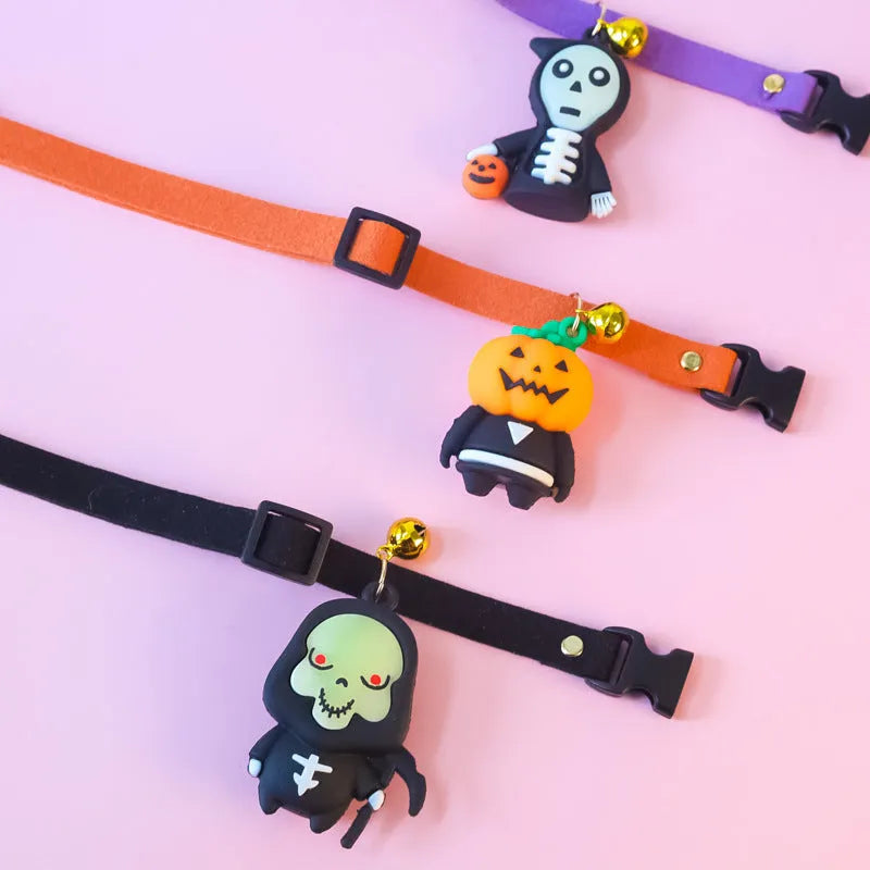 Halloween dog collar with pumpkin man and glow-in-the-dark skull designs in adjustable sizes.
