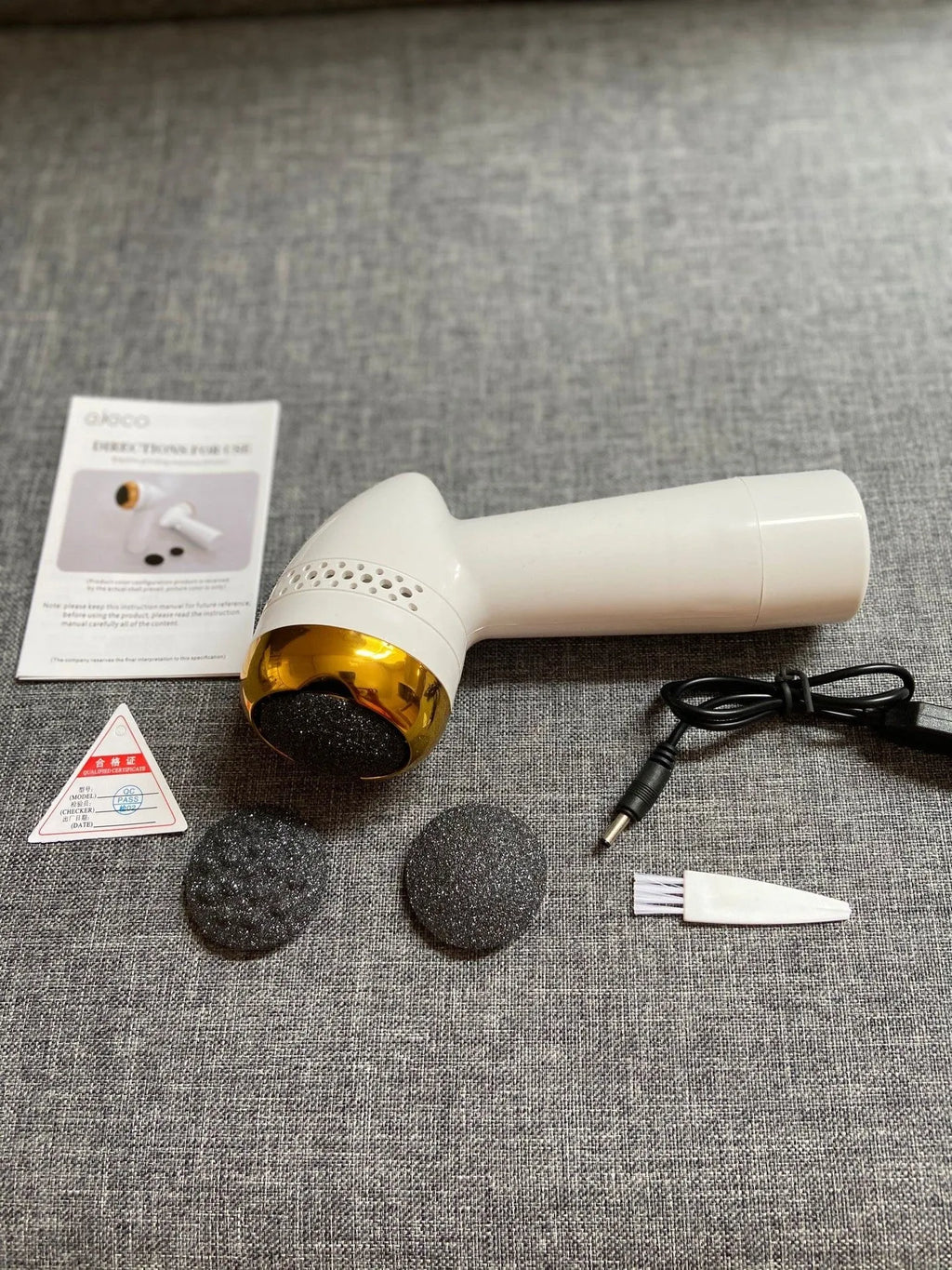 Electric vacuum foot grinder with quartz grinding head in metallic colour options.