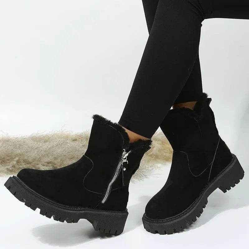 Women's black faux suede high-top snow boots with side zipper and thick plush lining.