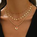 Geometric heart pendant on an adjustable three-layer zinc alloy clavicle chain necklace.