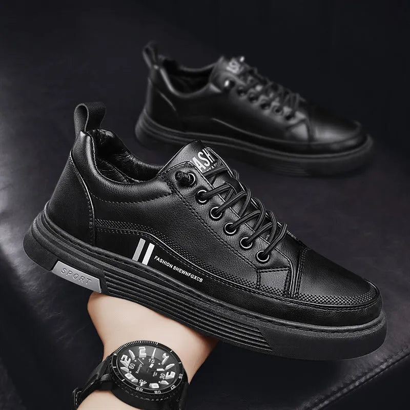 Men's white low-top skate shoes with elastic band and round toe, on a plain background.