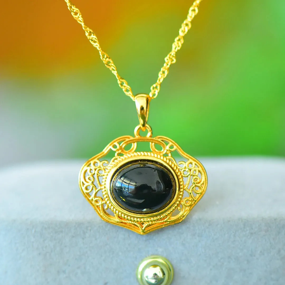 Close-up of a natural Hetian jade pendant with intricate copper inlay detail on a necklace chain.