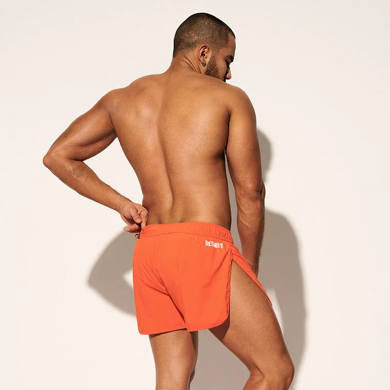 Men's loose fit summer shorts in orange, green, or black for beach and surfing leisure wear