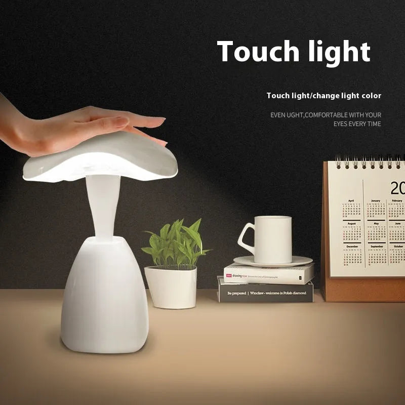 White modern LED desk lamp with a touch-sensitive base and plastic shade.