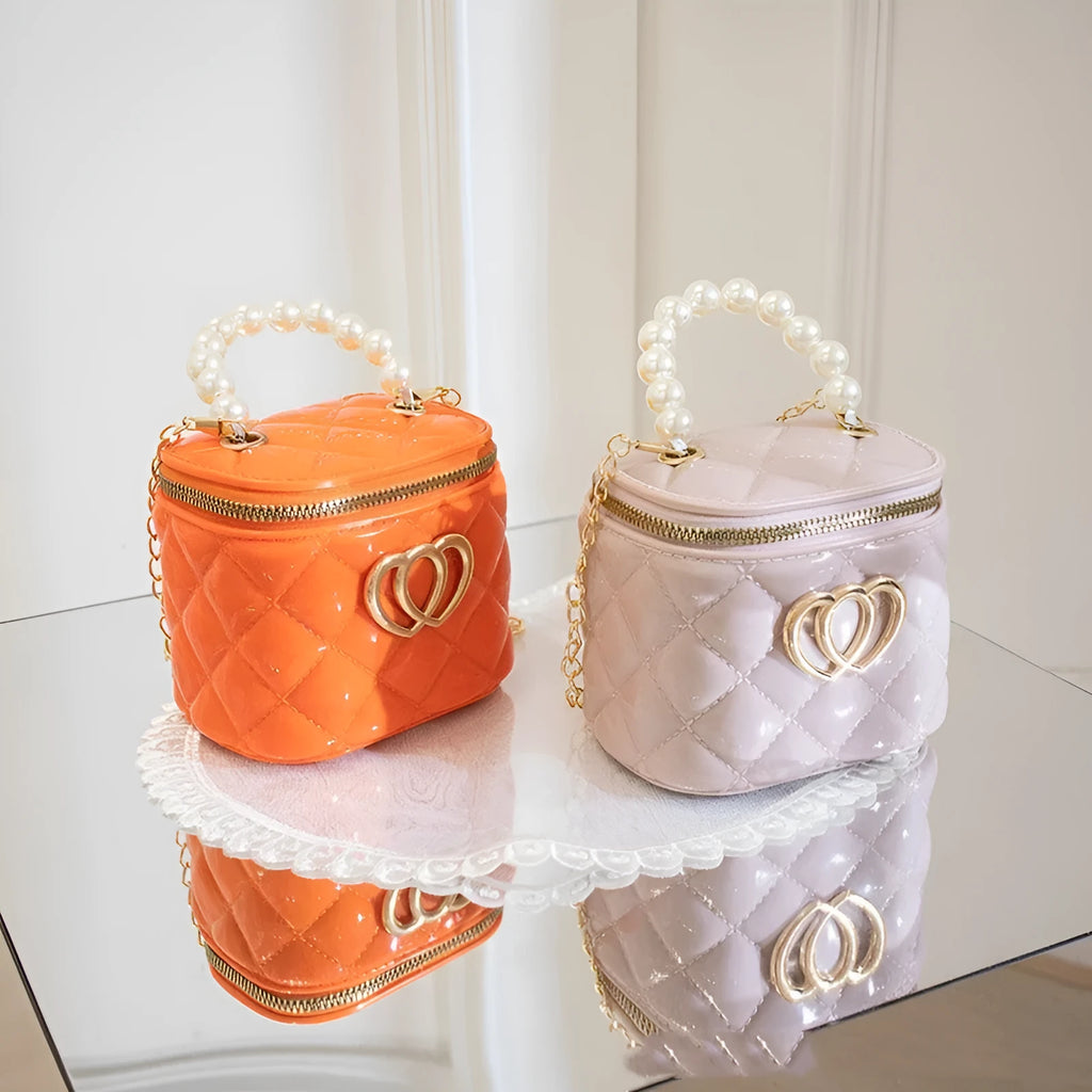 Women's white PVC bucket gel handbag with a red heart-shaped pattern lining.