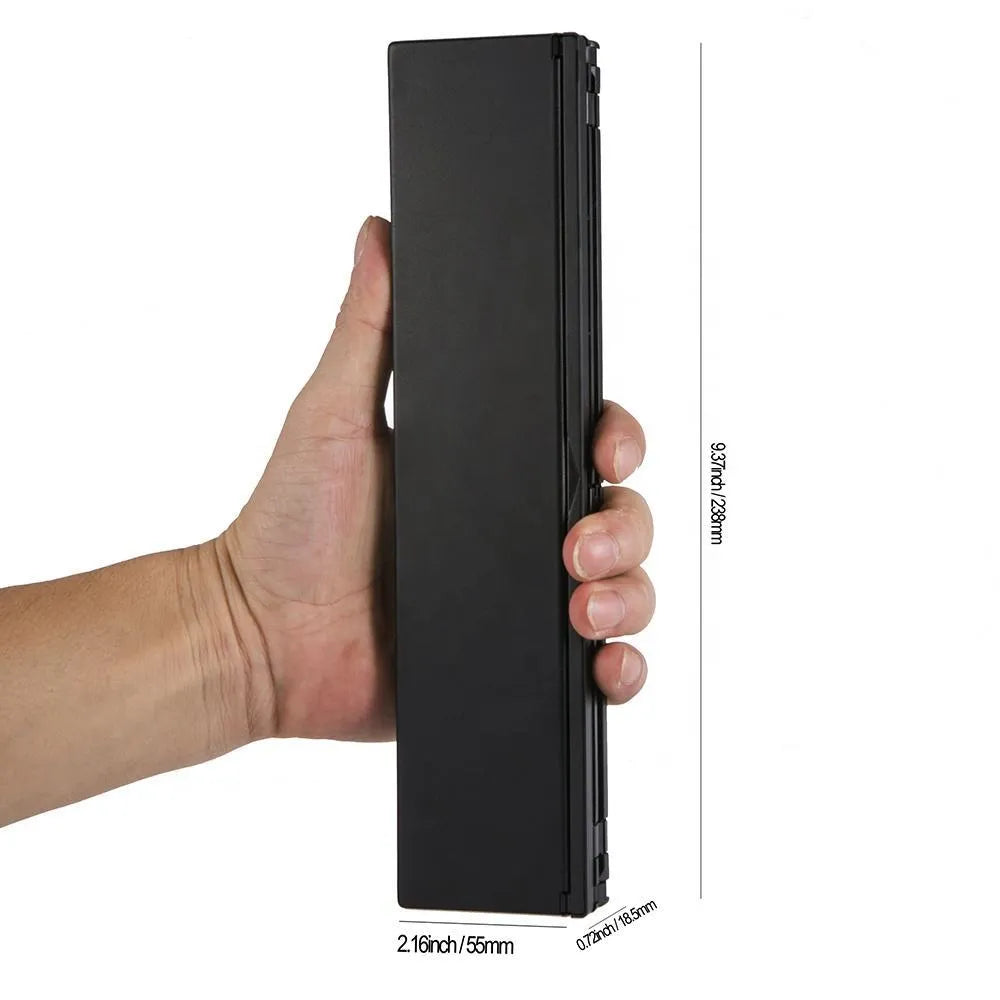 Black folding Bluetooth keyboard for tablets with aluminium bottom cover in open position