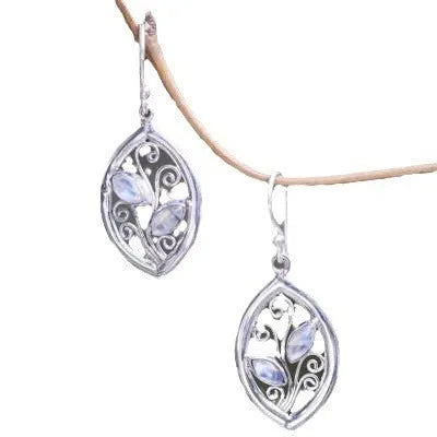 Silver-coloured alloy earrings shaped like a leaf with colourful moonstone stones embedded in the design.
