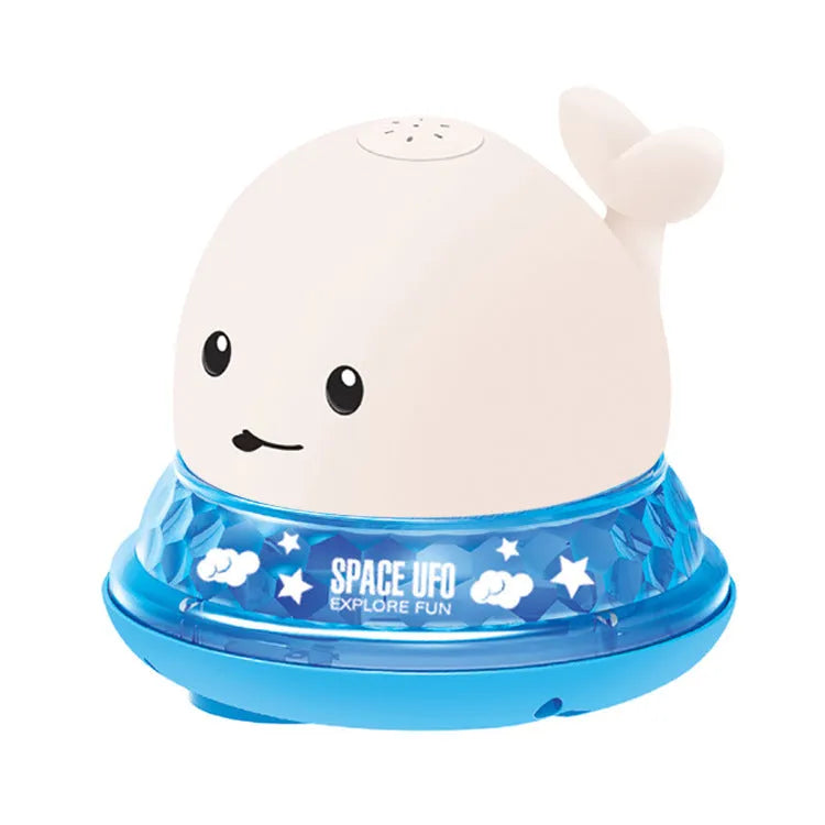 Blue and white whale bath toy with water spray and flashing lights for baby sensory play