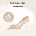 Champagne gold pointed toe stiletto high heel pumps with slip-on closure on a plain background.