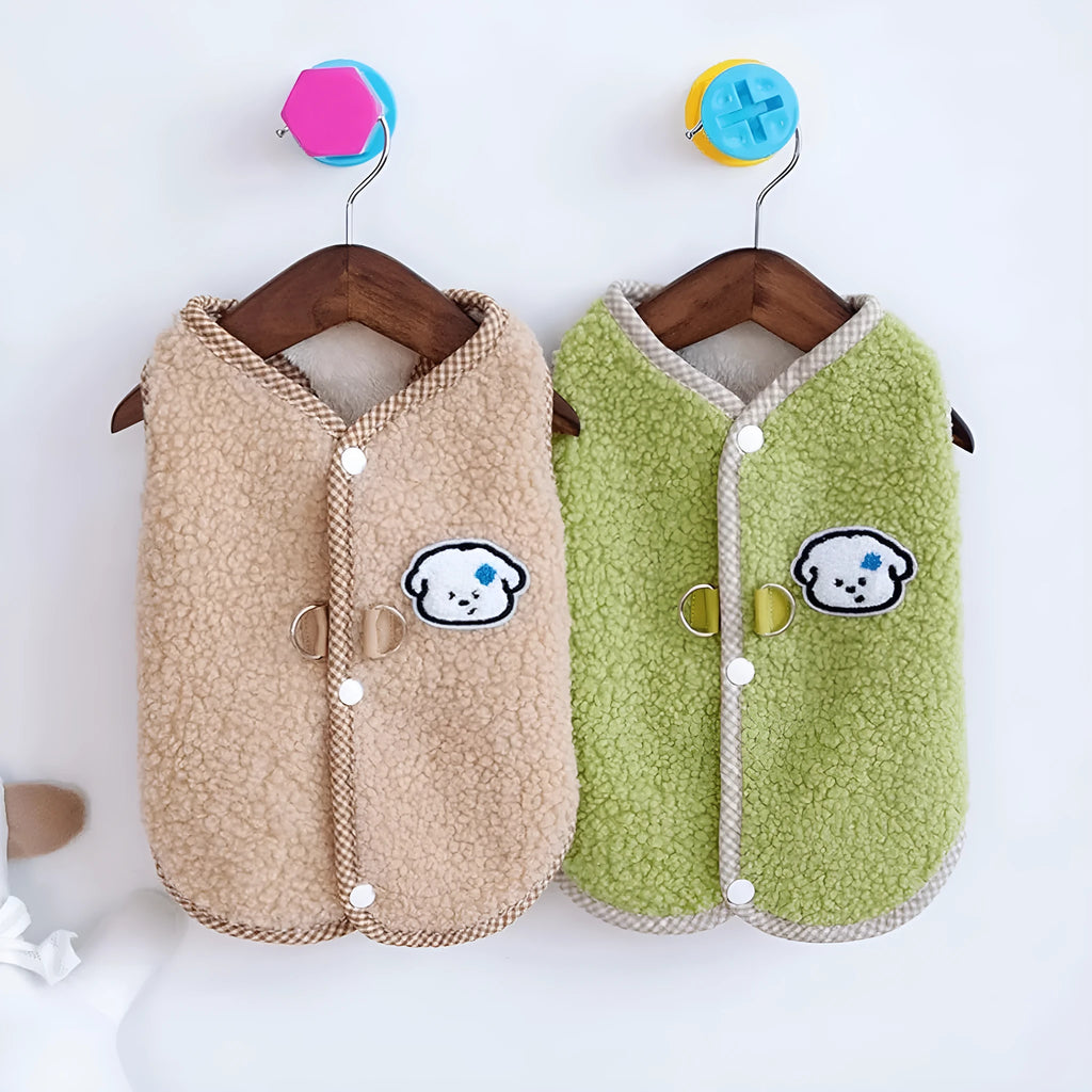 Green coral fleece dog vest with a metal leash ring on the back, shown on a small dog.