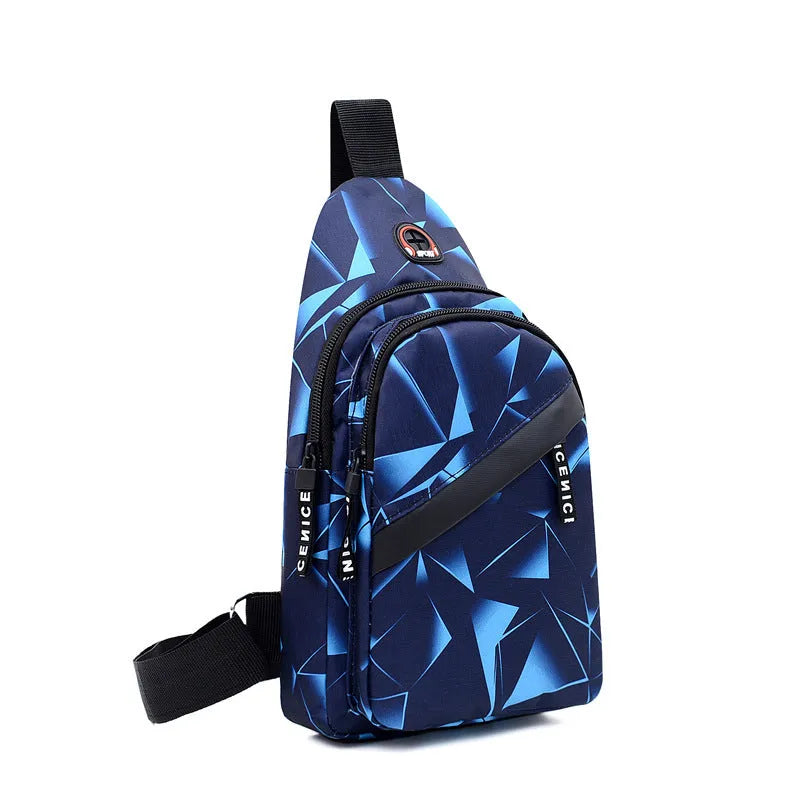Men's blue Oxford cloth crossbody sling bag showing earphone hole and front zipper.