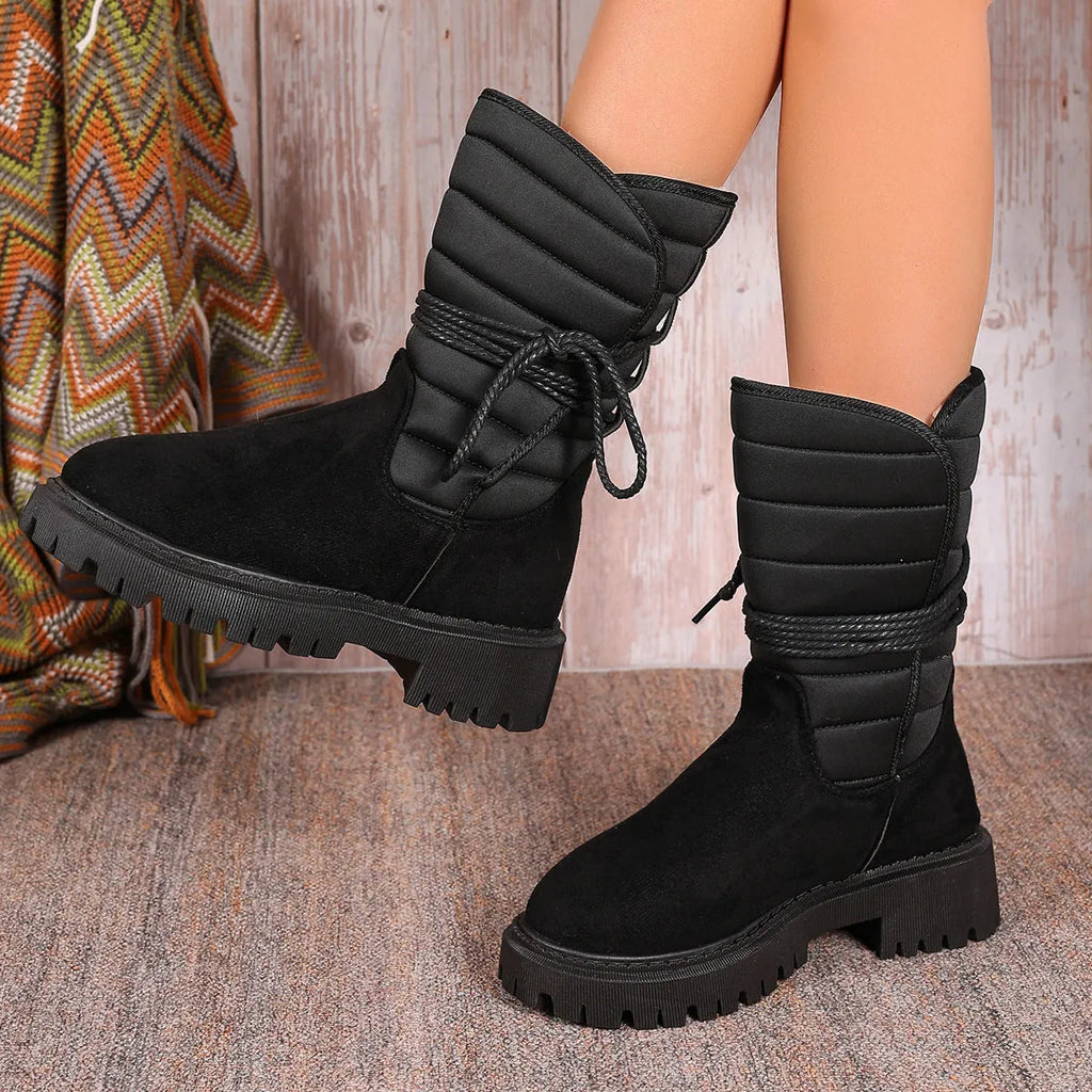 Women's black chunky heel snow boots with lace-up front and fleece lining
