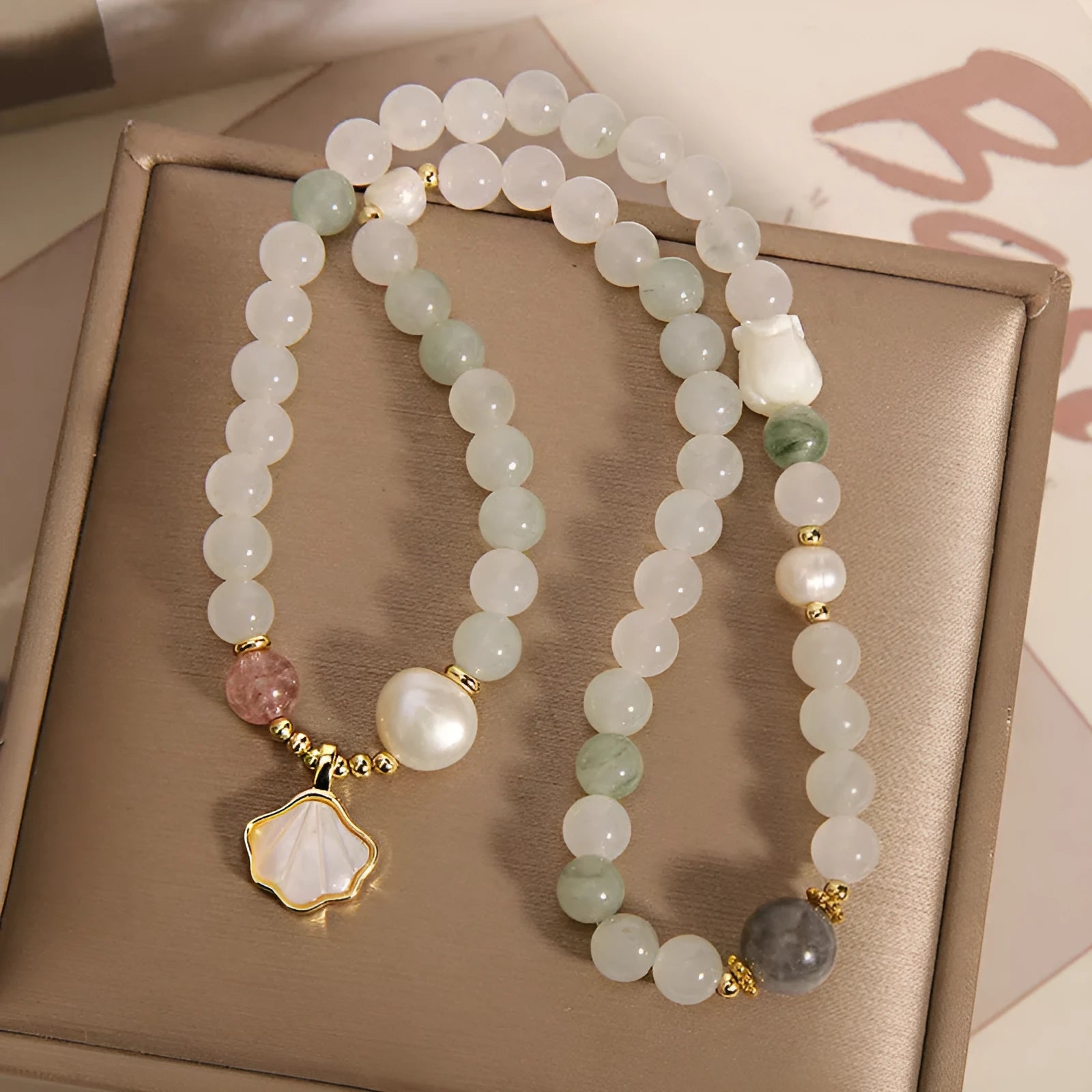 Tianshan emerald green crystal bracelet with gold-plated ginkgo leaf pendant and rhinestone details