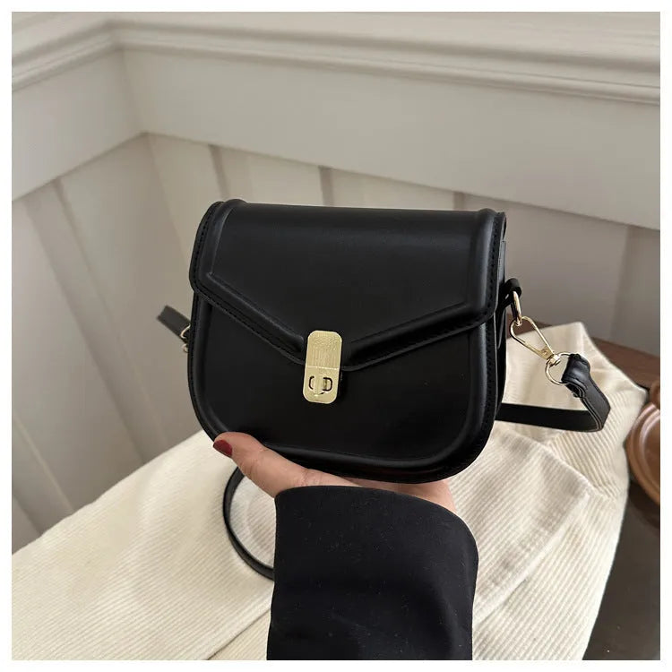 Niche texture shoulder messenger bag in soft PU leather with clamshell opening and horizontal square shape