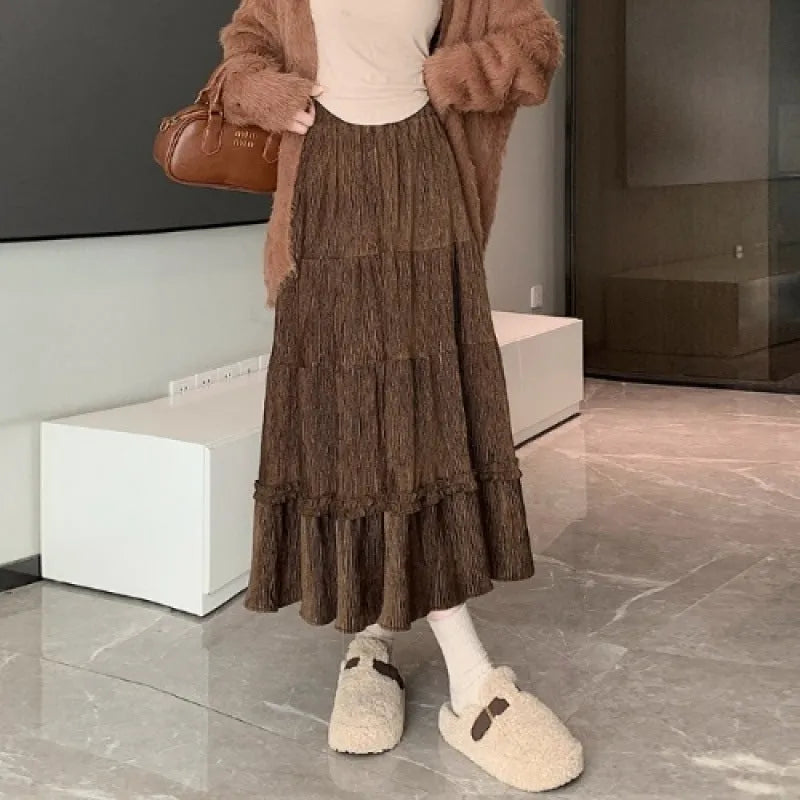 Women's corduroy A-line midi skirt with elastic waistband in milky white, black, and brown colours