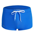 Men's low waist nylon swimming trunks in a solid colour on a white background.