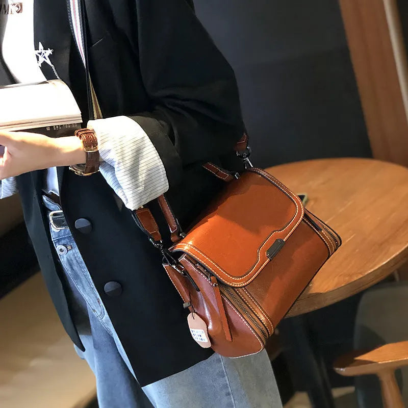Women's retro style genuine leather messenger bag in horizontal square shape with multiple internal compartments
