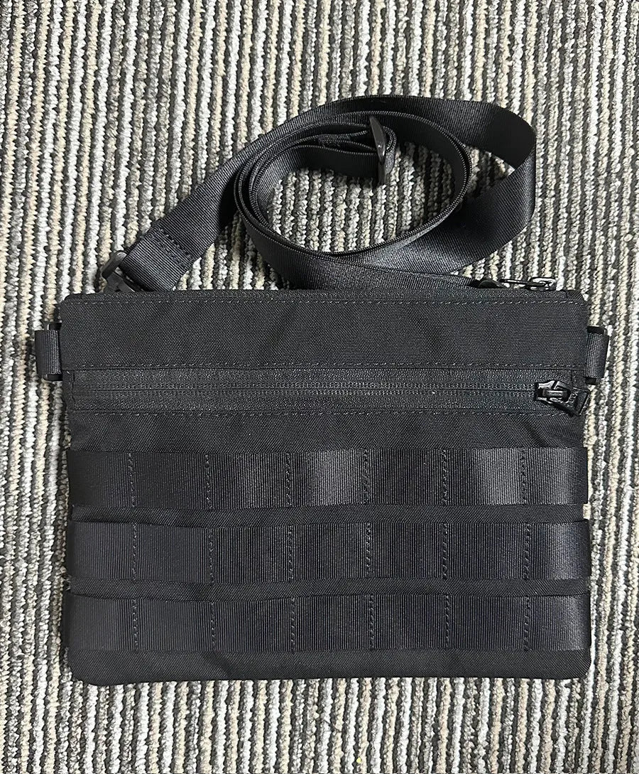 Black Oxford cloth portable outdoor kit measuring 18 by 3.5 centimetres