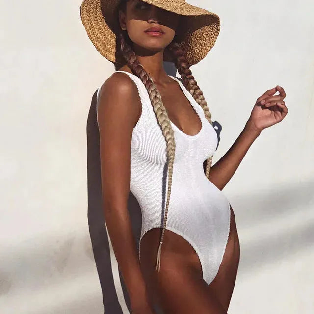 Women's solid colour seersucker one-piece swimsuit with a backless design