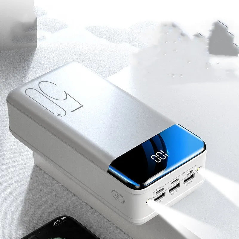 Black and white large capacity 50000mAh power bank with multiple USB ports for charging.