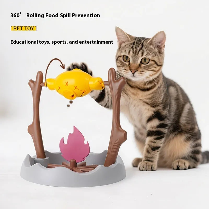 Tumbling barbecue-style cat feeder toy with leakage food dispenser, shown in plastic construction.