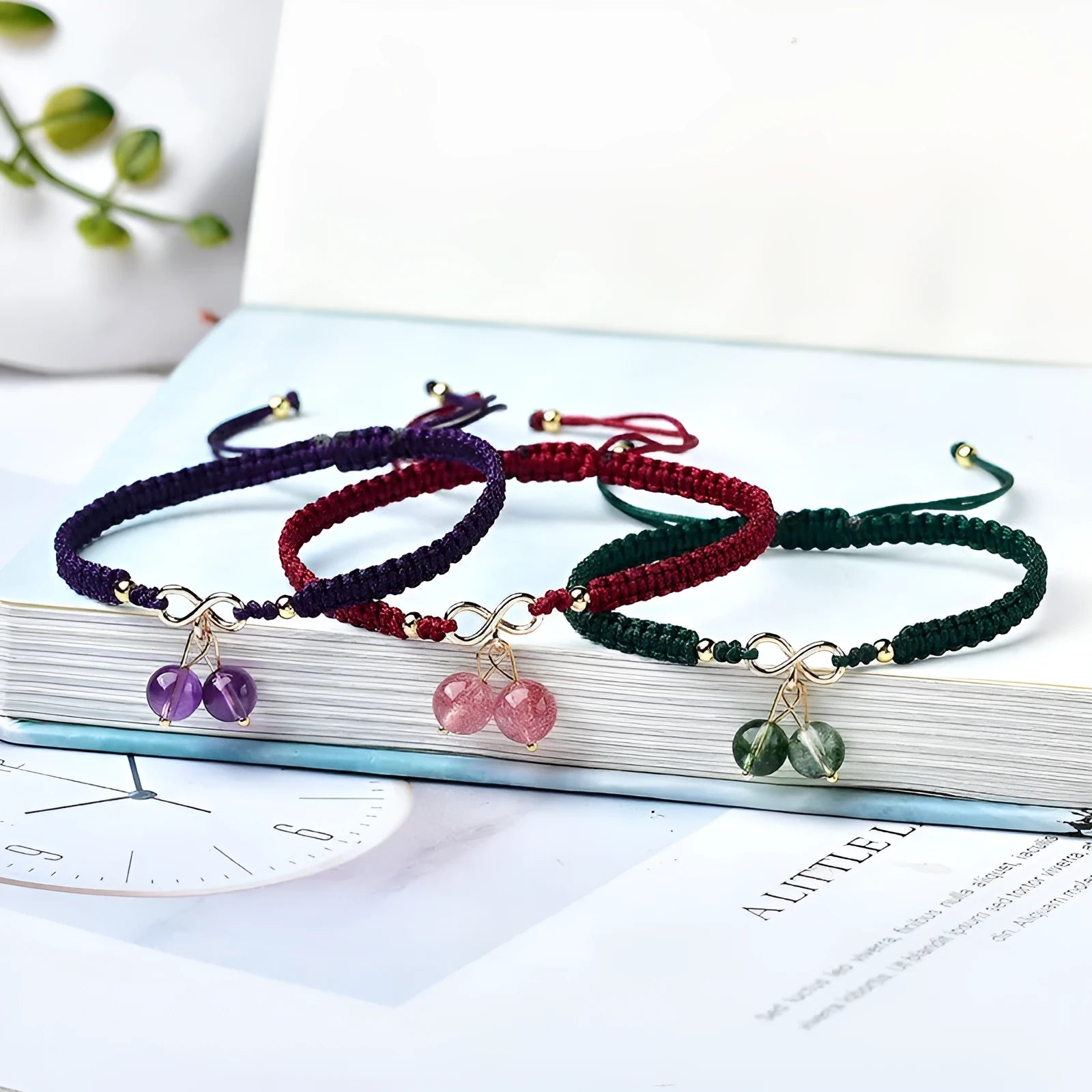 Women's natural strawberry quartz crystal bracelet with cherry charm on adjustable beaded band