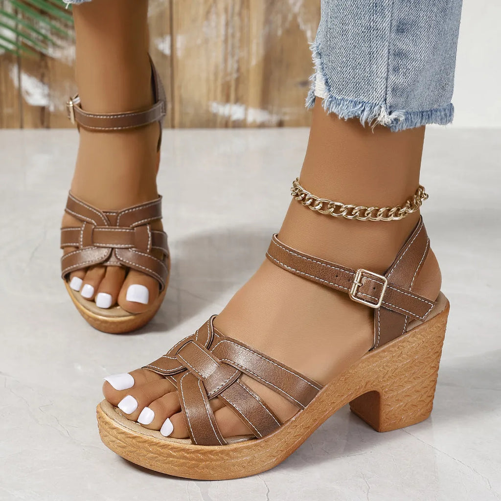 Plus size women's black peep toe sandals with a chunky heel and buckle ankle strap