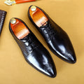 Men's cowhide leather pointed carved formal shoes in black, brown, or wine red with rubber sole