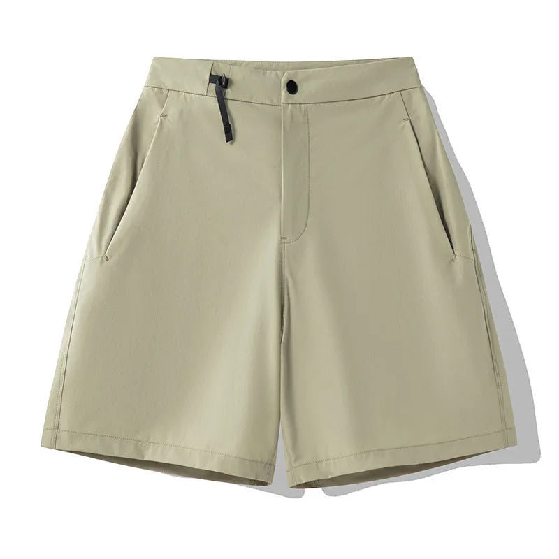 Men's solid colour quick-dry sports shorts with elastic sides on a neutral background.