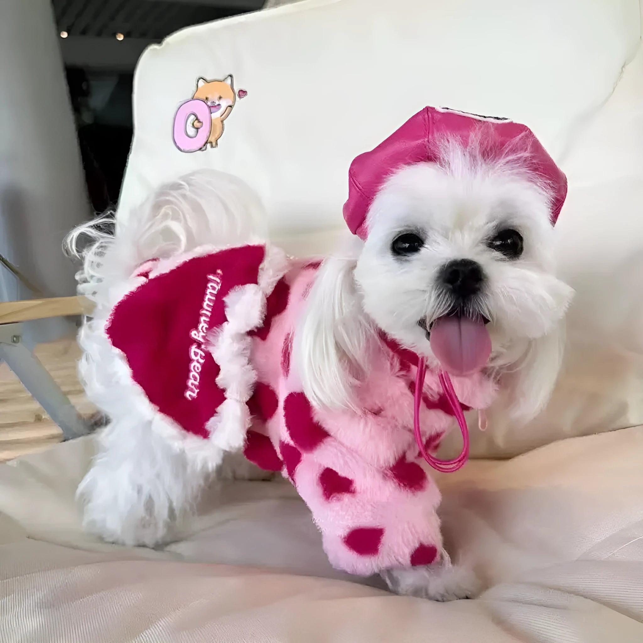 Small dog wearing pink warm plush coat with six size options from XS to 2XL