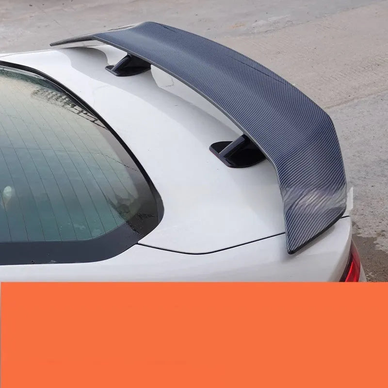 Universal punch-free ABS plastic car tail wing spoiler shown in carbon fibre pattern finish