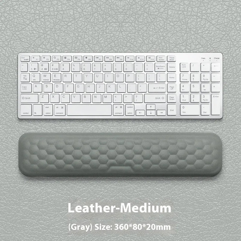 Grey and black memory foam mouse wrist pads with silicone bases, shown in cloth and leather cover options.
