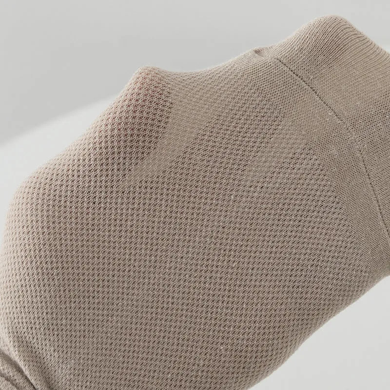 A pair of solid colour low-cut polyester boat socks for men, shown in one of six available colours.