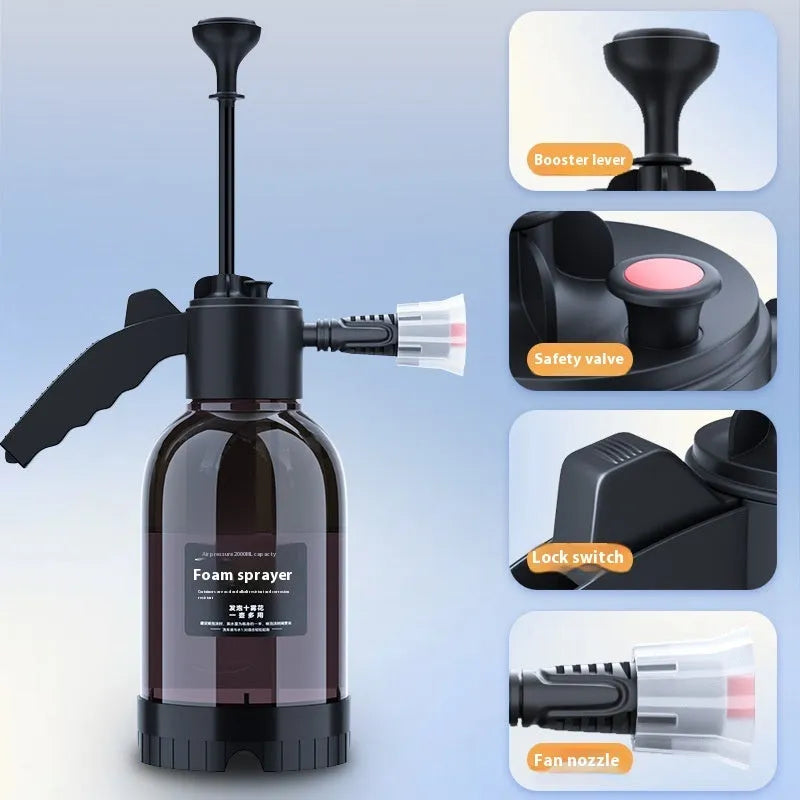 Black hand-held 2-litre multi-purpose sprayer with ergonomic handle and two nozzles