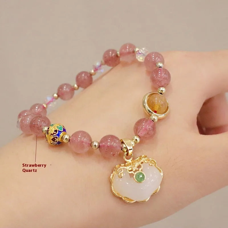 Geometric ethnic bracelet for women in choice of gray jade or strawberry quartz stone with metal decoration.
