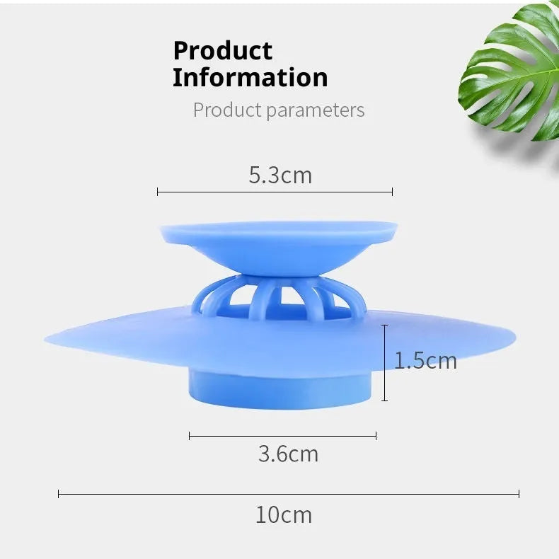 UFO-style silicone press sink drain cover in blue on a white basin, modern minimalist design