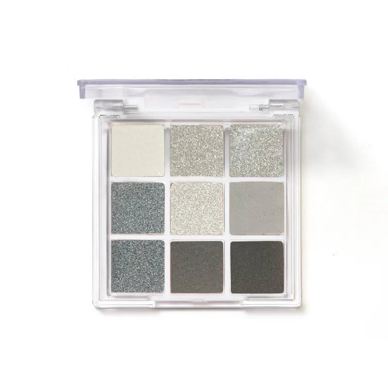 Smoked design nine colour eyeshadow palette open showing white, silver, black, iron grey shades.