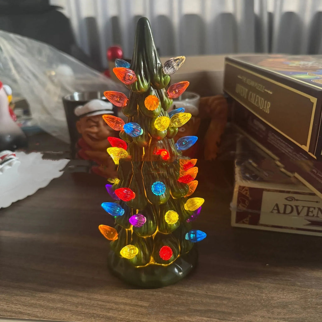 European-style resin Christmas tree ornament with integrated LED lights in coloured or warm white.