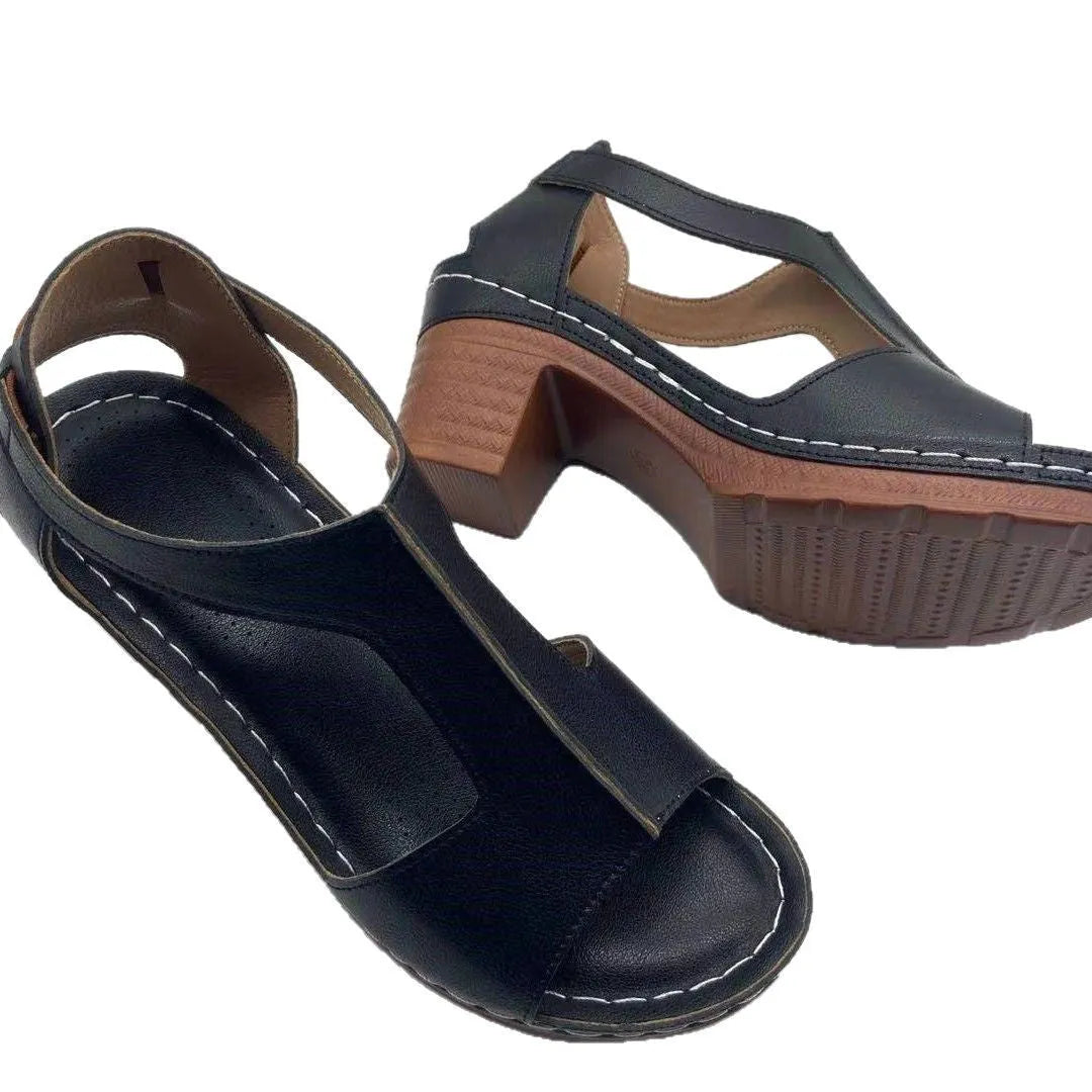 Women's white peep toe wedge sandals with a buckle strap on the ankle.