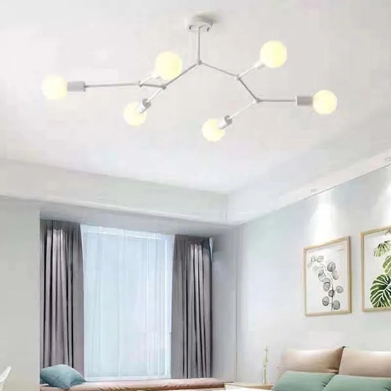 Nordic style iron ceiling chandelier with multiple black heads against a white background.