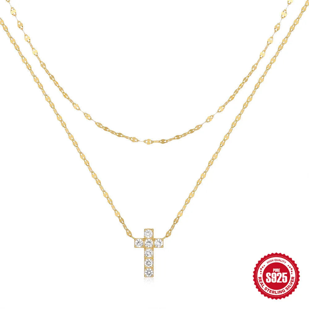 S925 sterling silver double layer cross pendant necklace with twin diamond details on a clavicle chain.