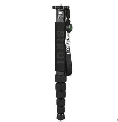 Black carbon fibre SLR camera monopod extended to maximum height with six visible sections